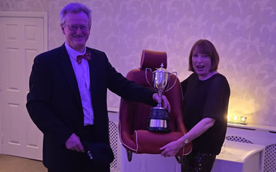Len receiving trophy from Sam Browne at the annual dinner 2024